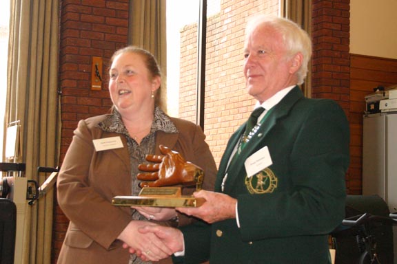 Kath receiving the Helping Hand Award from GNAS president Dennis Whiteman. Photo by Mick Fitzpatrick
